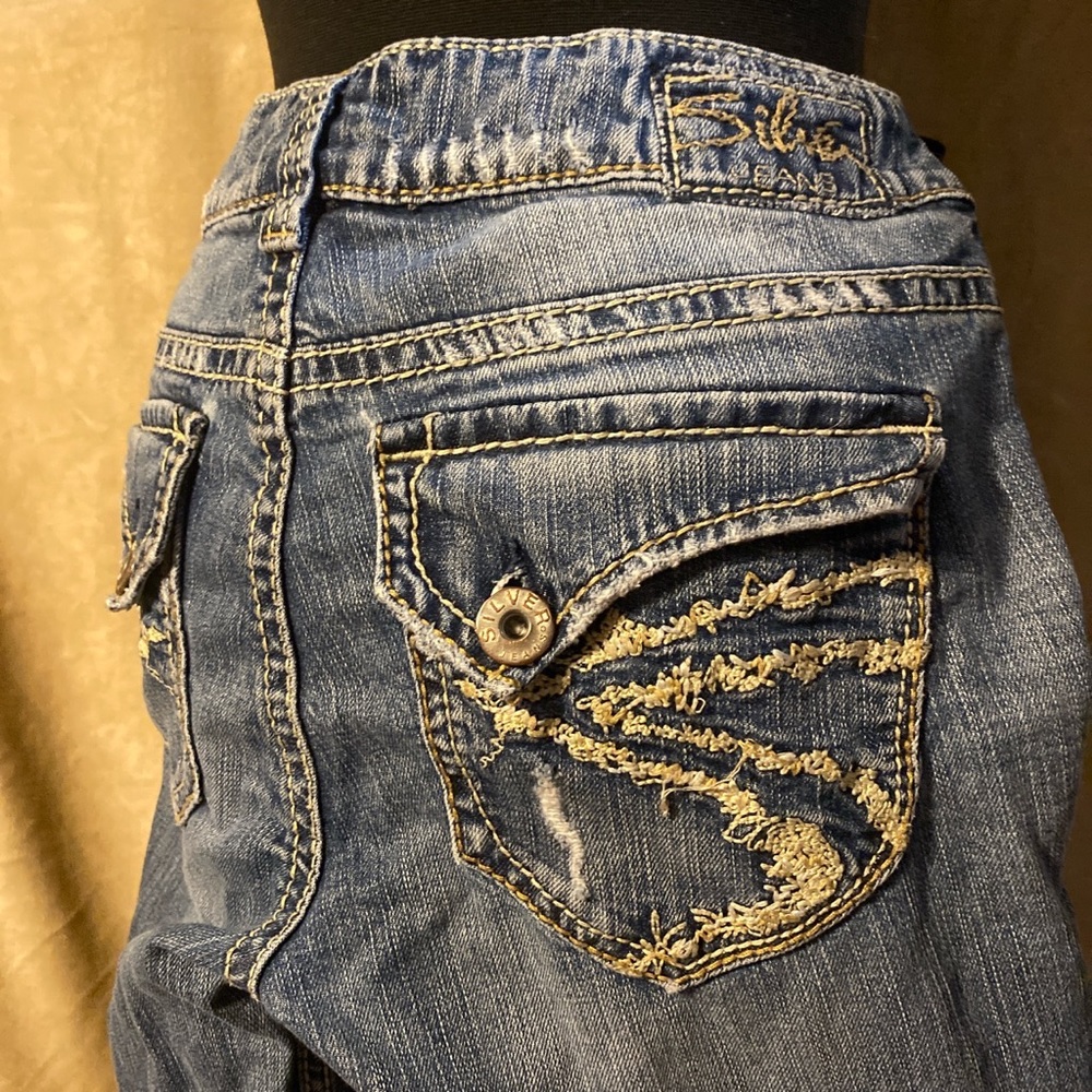 Distressed skinny flared silver jeans; gold hemming; y2k